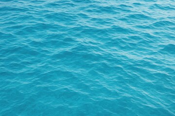 Obraz premium Abstract ocean-inspired background featuring textured blue water with waves and ripples