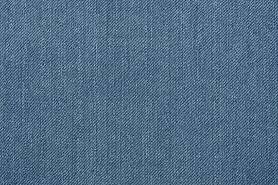 Classic denim fabric background showing traditional jean weave pattern