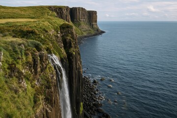 Obraz premium Historic rock formations shaped like a traditional garment with cascading water on a remote island produce a mesmerizing soundscape.