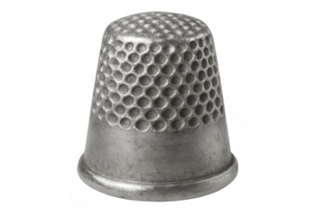 Close-up of a metal thimble with a textured surface, isolated on a transparent background, ready for sewing and protecting fingers