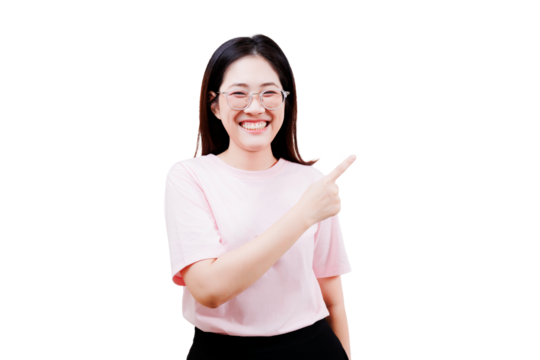 Asian young beautiful smiling woman with glasses wearing a light pink t-shirt is pointing to her right with a cheerful expression.