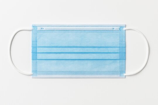 White background featuring a protective face mask