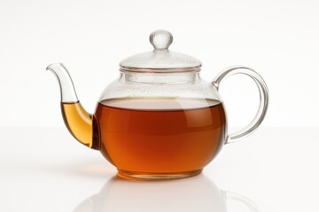 Clear glass teapot on a plain white backdrop