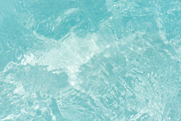 Blue water with ripples on the surface. Defocus blurred transparent blue colored clear calm water...