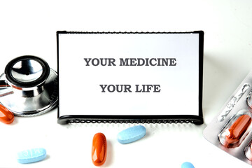 The conceptual phrase is YOUR MEDICINE YOUR LIFE. Invest in your health Concept.
