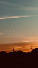 A peaceful sunset over the ocean, with vibrant orange hues reflecting on the waves as they gently reach the sandy shore.&rdquo; 