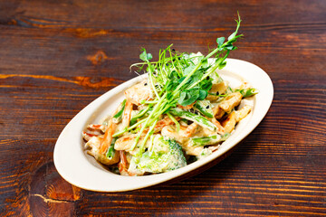 Freshly prepared vegetable pasta served on a rustic wooden table highlighting healthy dining options
