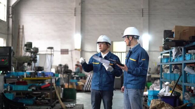 asian engineer working in workshop