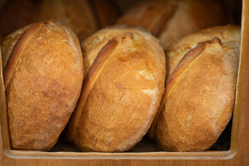 Freshly baked sourdough breads on shelves n a traditional bakery in Turkey