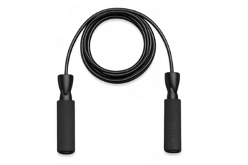 Black jump rope lying on clear surface, highlighting exercise equipment for fitness training and cardiovascular workouts