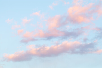 Soft pastel clouds in blue evening sky