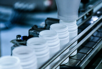 Close up counting and automatic tablet bottling machine in the pharmaceutical industry production line