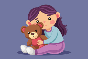 A little girl in pajamas snuggles into a teddy bear, her face showing sadness and tenderness