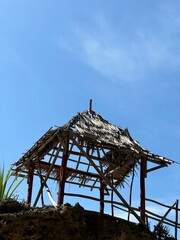 Simple outdoor shelter on a rocky outcrop