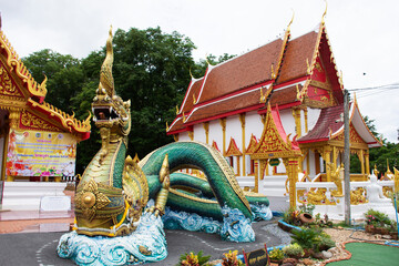 Fototapeta premium Ancient naga or antique naka statue of Wat Phra Kaew temple for thai people traveler travel visit and respect praying and blessing holy mystery worship at Chainat on May 27, 2020 in Chai Nat, Thailand