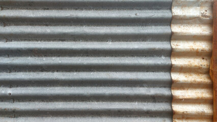 lang="x-default" Corrugated iron sheet showing rust and corrosion creating an industrial background