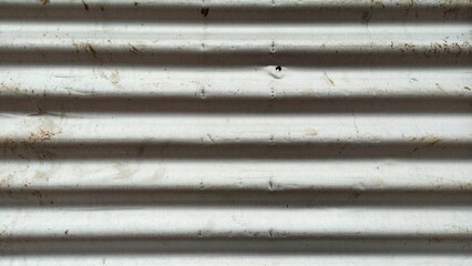 lang="x-default" White corrugated iron sheet metal background forming a construction fence