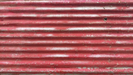 lang="x-default" Red corrugated iron sheet metal background forming a construction fence