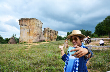 Thai women people travel and posing shooting photo with Mor Hin Khao © Anirut