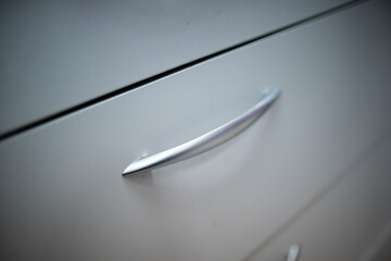 A CloseUp View of a Modern and Stylish Drawer Handle that Enhances Any Contemporary Design