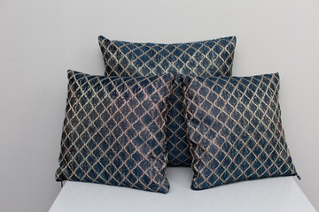 Beautifully designed Elegant Textured Cushions resting on a Table, adding charm and style