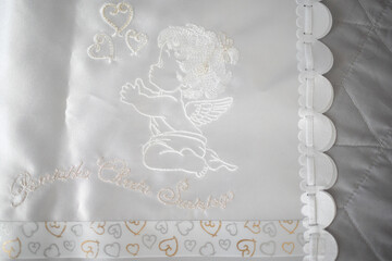 This exquisite and elegant angel embroidery is featured on a delightful baby blanket