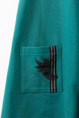 This is a stunning and elegant Teal Jacket featuring intricate and beautiful embroidery