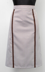 This is an Elegant ALine Skirt that features a Chic Pattern along with Contrasting Trim detail