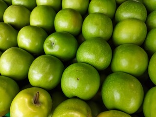 Ripe green apple background. Fresh green apple at market. 