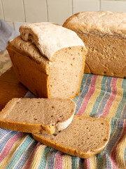 A loaf of bread sitting on top of a wooden cutting board