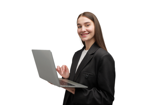 Smiling professional portrait of a woman with a laptop in a modern workspace reflecting confidence and creativity
