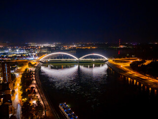 Novi Sad, Serbia June 26, 2025: Aerial view of Zezelj bridge over Danube in Novi Sad by night