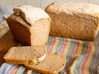 A loaf of bread sitting on top of a wooden cutting board