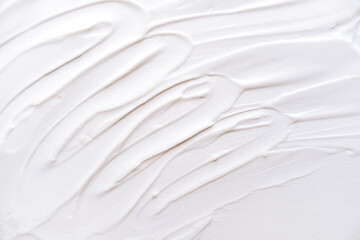 Smear of white cream texture on a white background , Body lotion for perfect skin