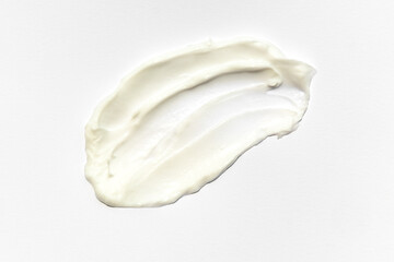 Smear of white cream texture on a white background , Body lotion for perfect skin