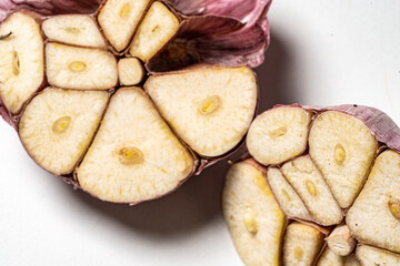 A head of large garlic in a cut, close-up, macro photography.