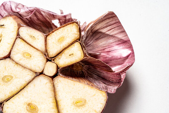 A head of large garlic in a cut, close-up, macro photography.