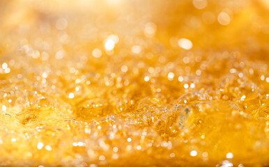 Close up bright orange Oil or beer splash texture and nature waves, Beautiful waves curve and...