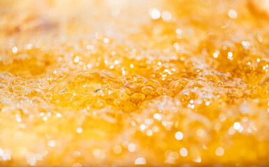Close up bright orange Oil or beer splash texture and nature waves, Beautiful waves curve and...