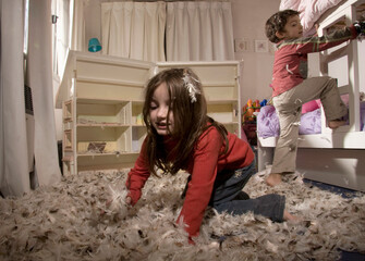 Children Playing in a Room Filled With Feathers During Games