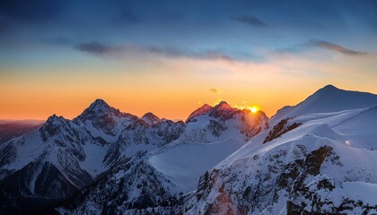 sunset over snowy mountain ridge