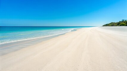 The calm, reflective surface of a wide, sandy beach under a bright, partly cloudy sky, with gentle waves barely touching the shore in the distance