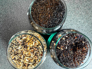 Assortment of herbal tea in glass jars