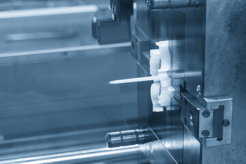 Close up scene the plastic parts from injection machine in the light blue scene.