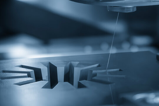 The die insert gear shape cutting process by wire EDM machine control by CNC program.