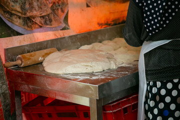 Selling and preparing gozleme with spinach at the Turkish market in Kreuzberg, Berlin.