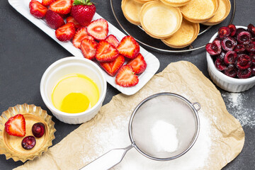 Sieve and flour on paper.