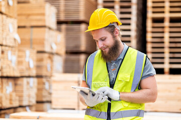 male carpenter factory worker  at manufacturing lines in wooden warehouse storage plant, wood...