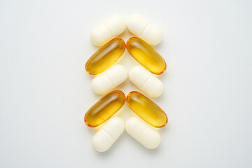 Clock made of pills capsules, pills form a circle, omega, vitamins, Cod liver oil, supplements