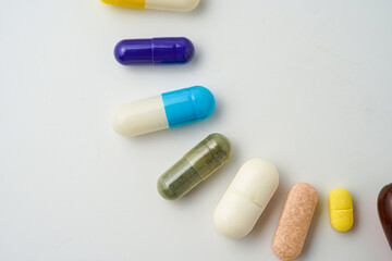 Clock made of pills capsules, pills form a circle, omega, vitamins, Cod liver oil, supplements